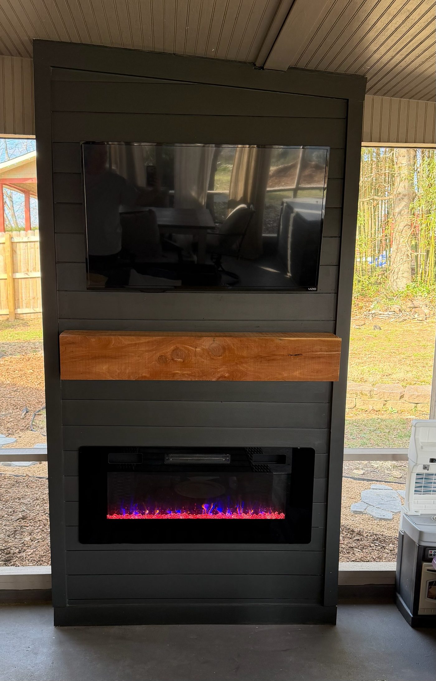 Modern fireplace with wood mantel